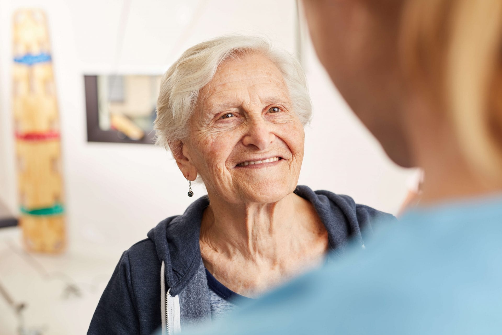 older woman smiling at caregiver