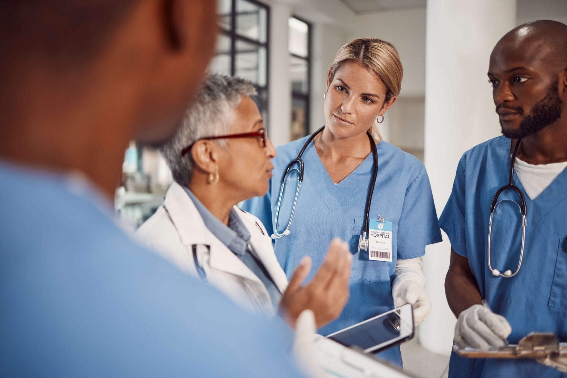 hospital team talking in hallway