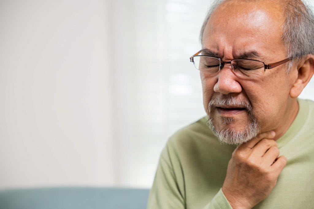 man having difficulty swallowing