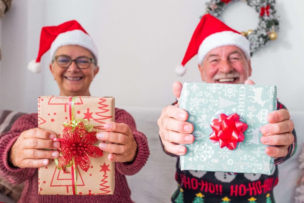 couple holding holiday presents