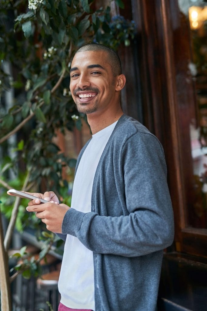 young man looking at phone